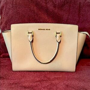 Michael Kors Cream Satchel with Winged Design and Gold Hardware